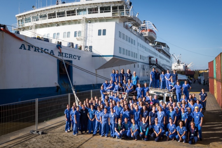 All the nurses of the Africa Mercy gathered on the dock for picture to celebrate the International Charity Day